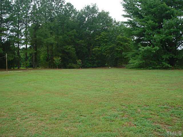 3595 Johnston County Road Angier, NC 27501 - Photo 17 of 18 a view of a field with a trees
