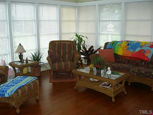 3595 Johnston County Road Angier, NC 27501 - Photo 5 of 18 a living room with furniture and a potted plant