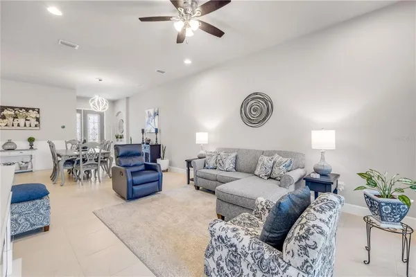 a kitchen with stainless steel appliances granite countertop a refrigerator sink and stove