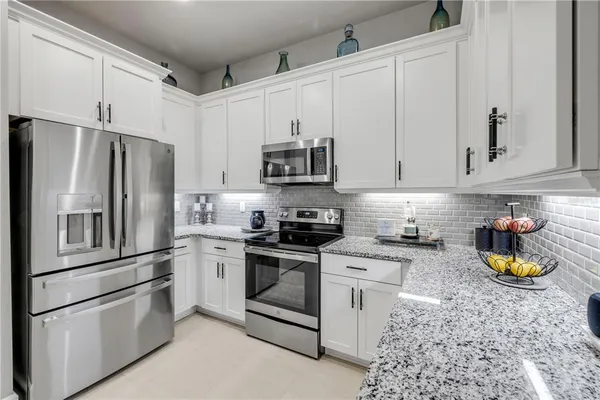 a bathroom with double sink and a mirror