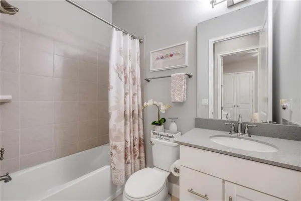 a living room with furniture and white walls