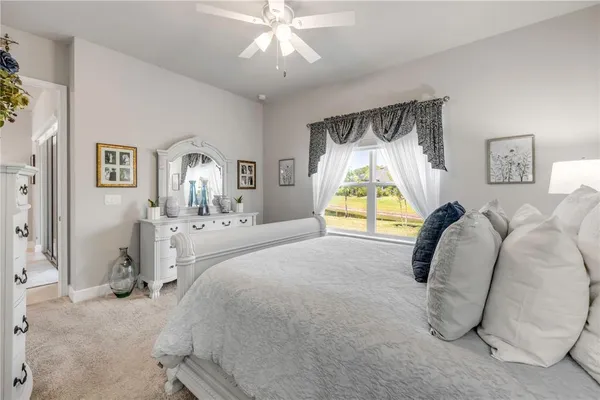 a bathroom with a shower sink vanity mirror and toilet
