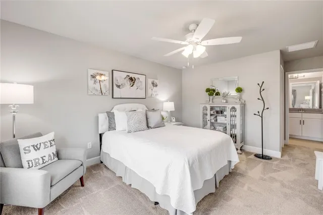 a view of a swimming pool with a yard and plants