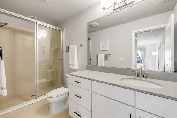 an aerial view of a house with a lake view