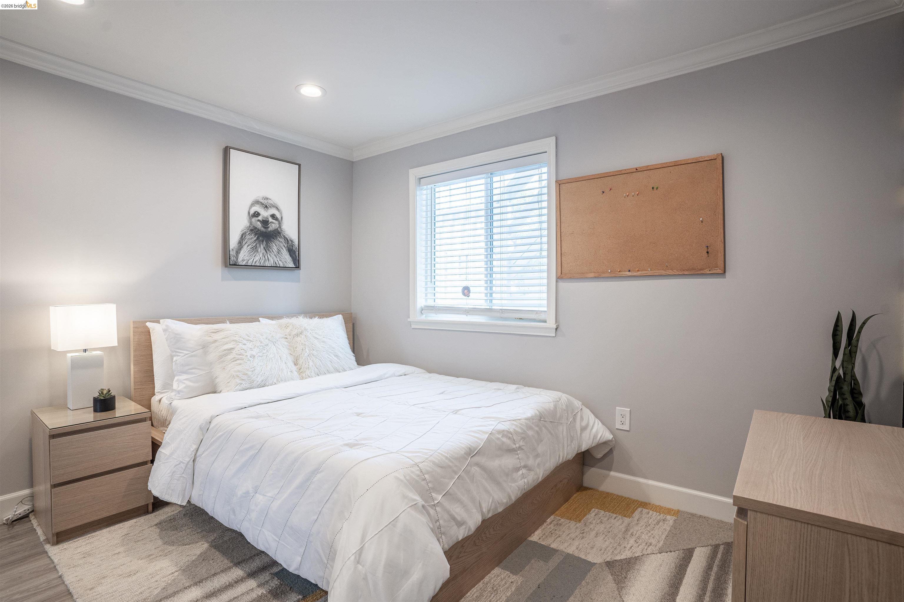 527 Chester Street Oakland, CA 94607 - Photo 13 of 47 525 (Downstairs) Bedroom with baseboards and crown molding