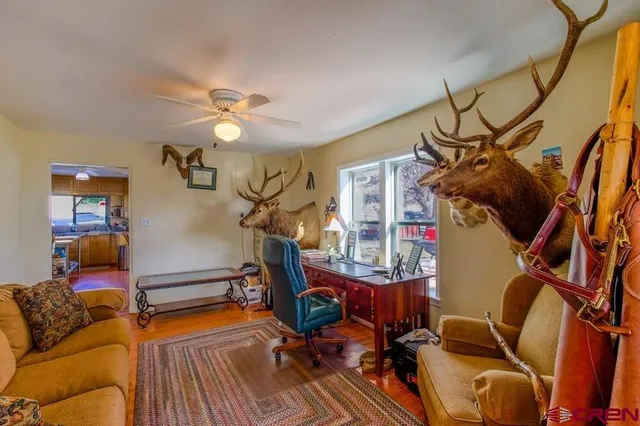 a view of a livingroom with furniture and a flat screen tv