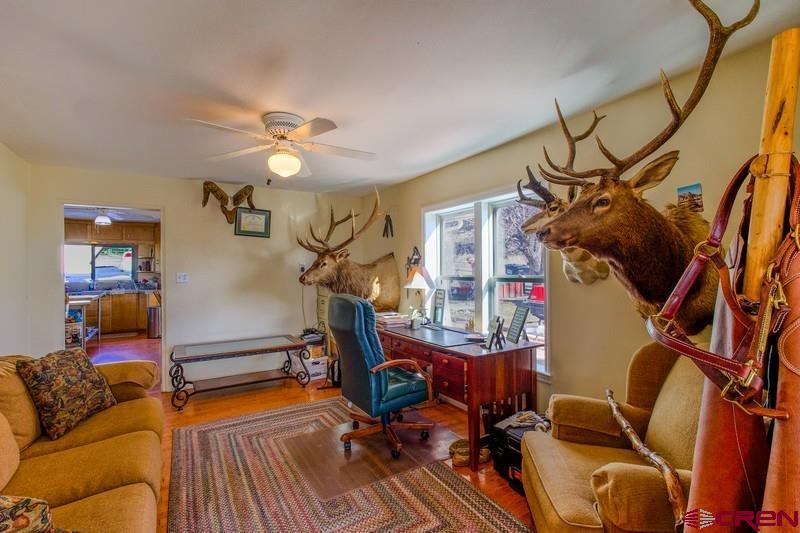 3115 Cr 973 Ignacio, CO 81137 - Photo 22 of 45 a view of a livingroom with furniture and a ceiling fan