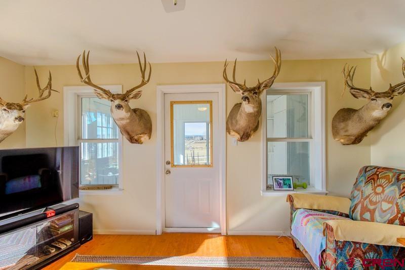 3115 Cr 973 Ignacio, CO 81137 - Photo 25 of 45 a living room with a flat screen tv and a fireplace