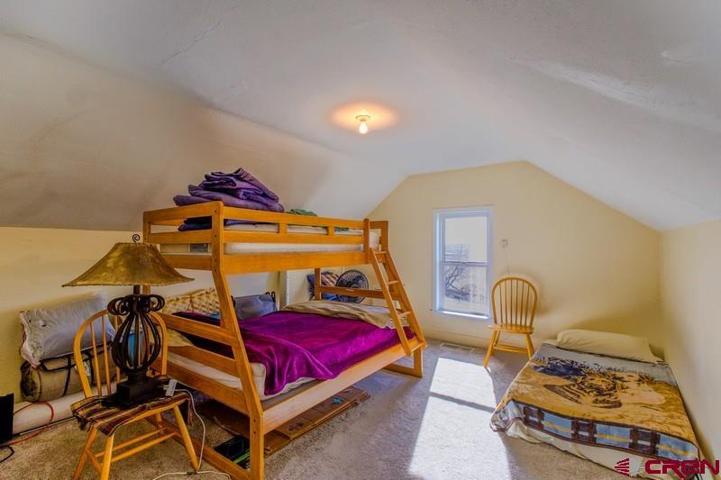 3115 Cr 973 Ignacio, CO 81137 - Photo 29 of 45 a bedroom with furniture and a mirror