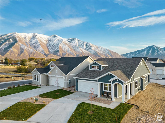 2033 Fortune Lane, Unit 462 Mapleton, UT 84664 - Photo 3 of 27 View of front facade with a garage and a mountain view