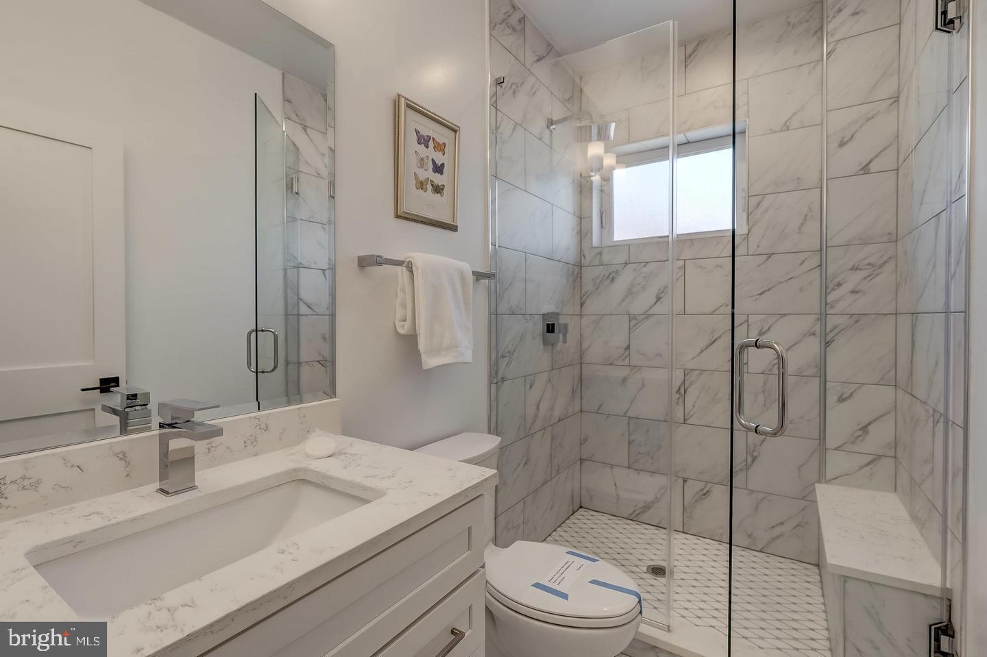 319 R Street Northwest Washington, DC 20001 - Photo 16 of 33 a bathroom with a granite countertop sink a toilet and shower