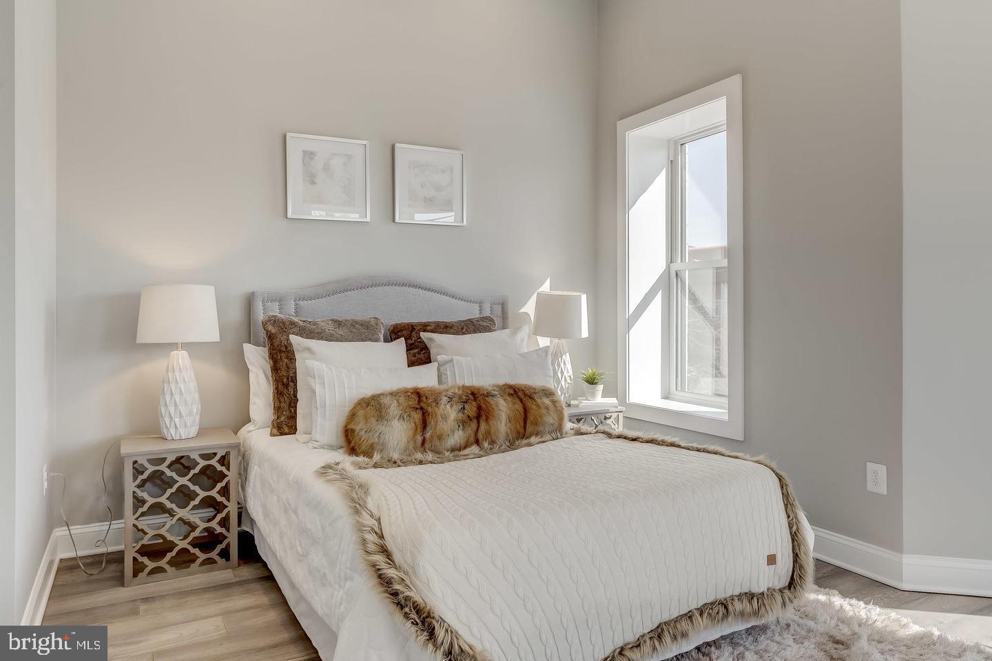 319 R Street Northwest Washington, DC 20001 - Photo 17 of 33 a bedroom with a bed and wooden floor