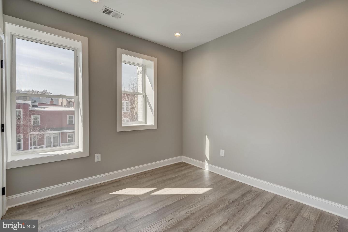 319 R Street Northwest Washington, DC 20001 - Photo 20 of 33 a view of an empty room with wooden floor and a window