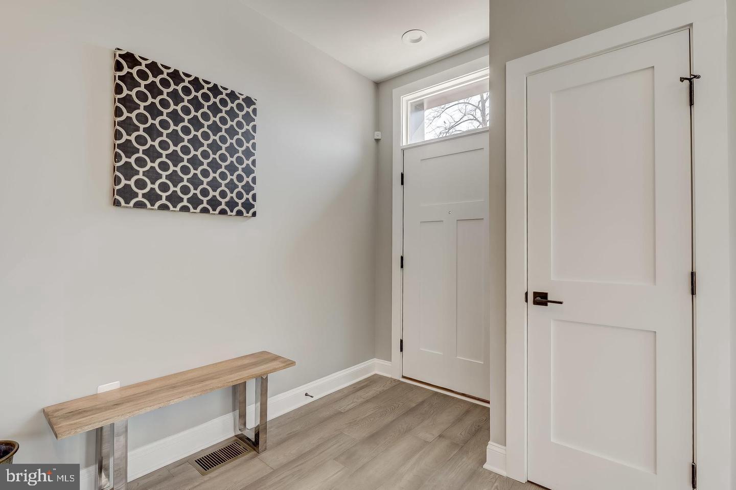 319 R Street Northwest Washington, DC 20001 - Photo 6 of 33 an empty room with wooden floor cabinet and window