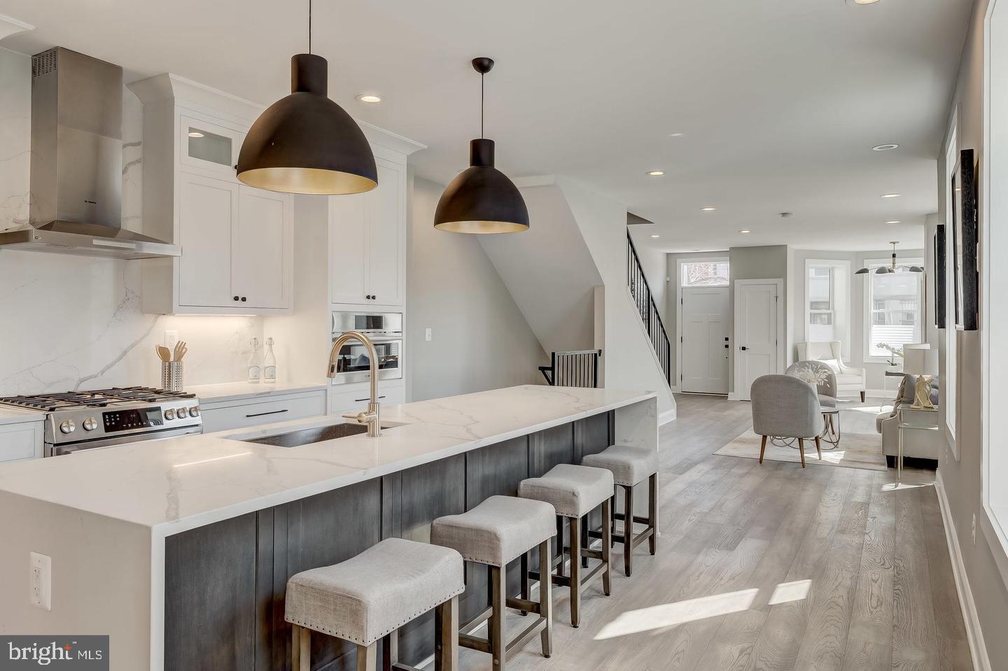 319 R Street Northwest Washington, DC 20001 - Photo 9 of 33 a kitchen with a table chairs stove and cabinets