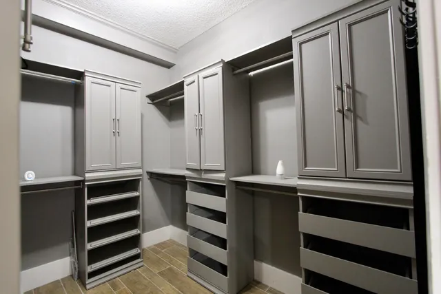 a kitchen with a refrigerator and cabinets
