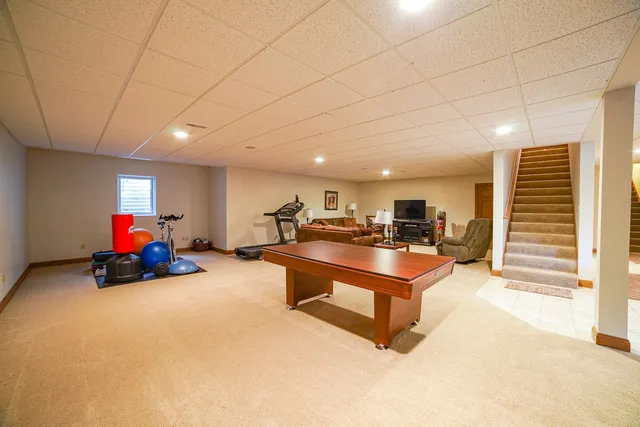a living room with furniture gym equipment and a view of living room