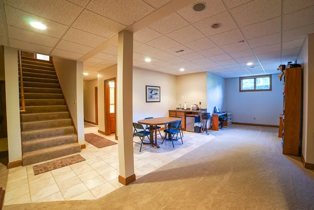 a view of a room with lots of furniture and lots of furniture