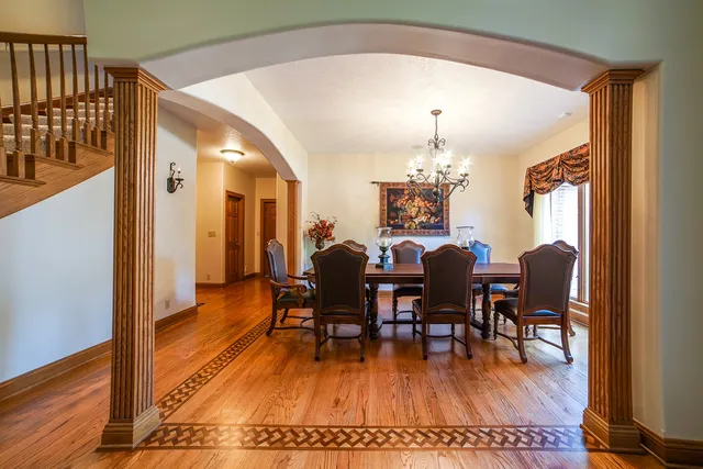 a view of a dining room with furniture and wooden floor