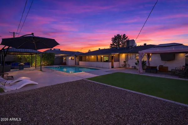 a view of a house with a yard