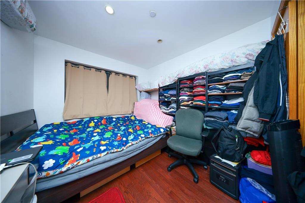 5418 3rd Avenue, Unit 1A Brooklyn, NY 11220 - Photo 6 of 12 a bedroom with bunk bed and a window