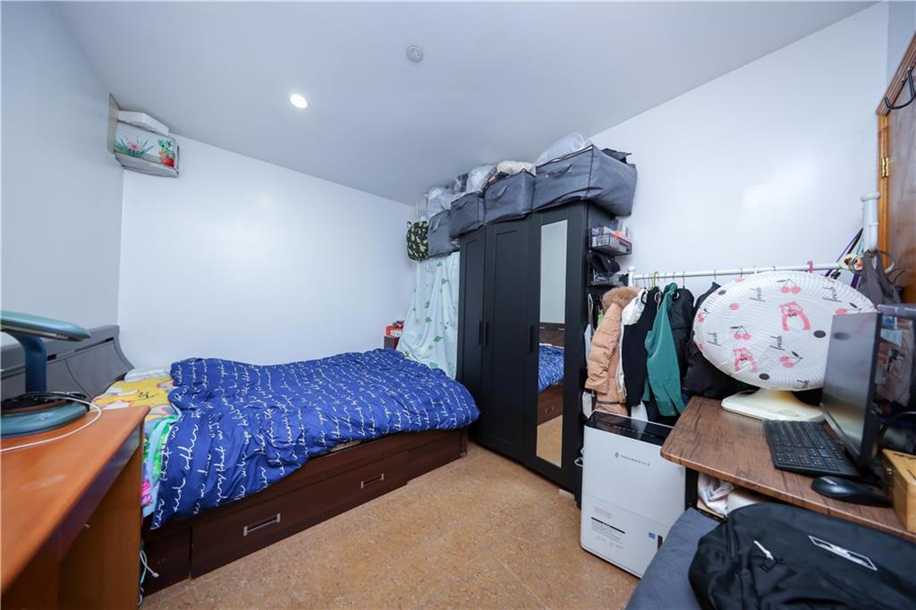 5418 3rd Avenue, Unit 1A Brooklyn, NY 11220 - Photo 7 of 12 a bedroom with bed and wooden floor
