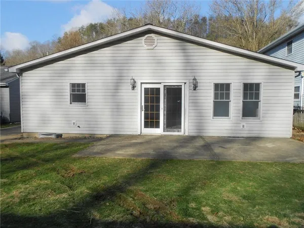 a view of a backyard of the house