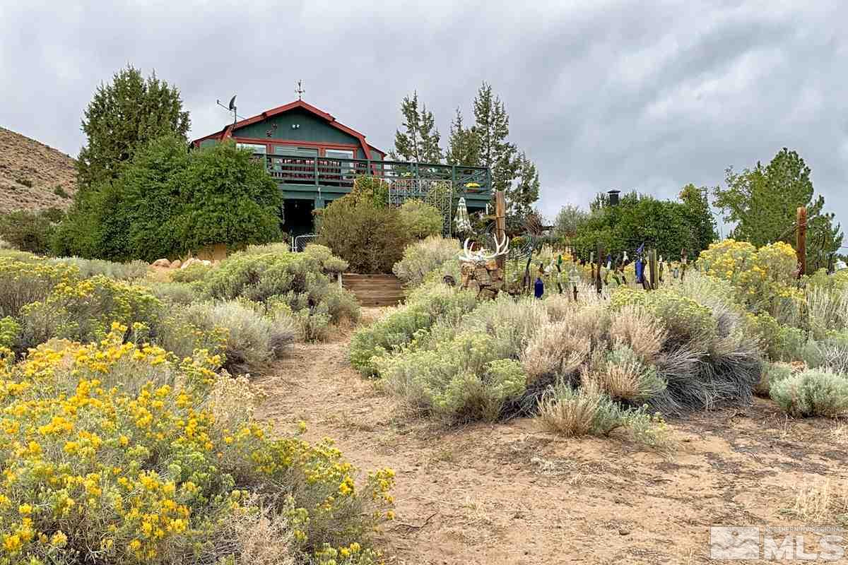255 Curnow Canyon Road Reno, NV 89510 - Photo 19 of 25 a view of a large garden with plants and large trees