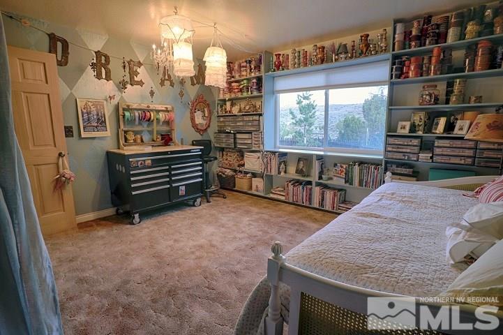 255 Curnow Canyon Road Reno, NV 89510 - Photo 10 of 25 a room with lots of wooden furniture and a book shelf