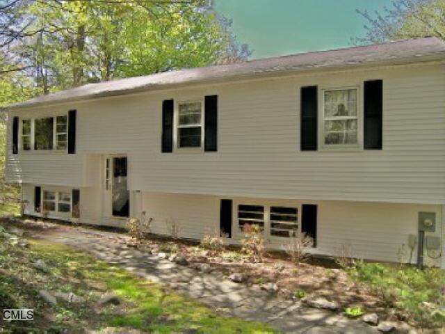 42 Carmen Hill Road New Milford, CT 06776 - Photo 1 of 1 a front view of a house with a yard