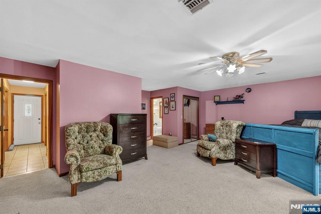 5110 Berkshire Valley Road Oak Ridge, NJ 07438 - Photo 24 of 49 a living room with furniture and a chandelier