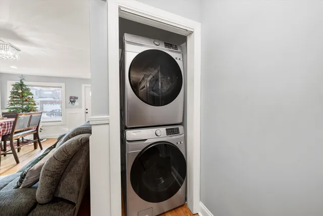 a view of a hallway with washer and dryer