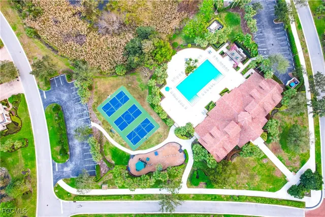 an aerial view of residential house with outdoor space and swimming pool