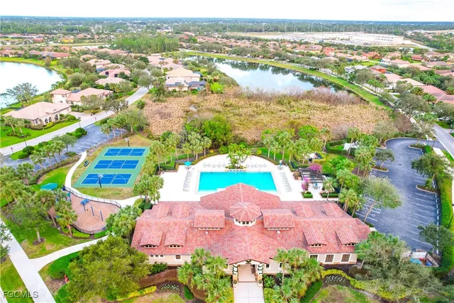 an aerial view of a residential houses and outdoor space