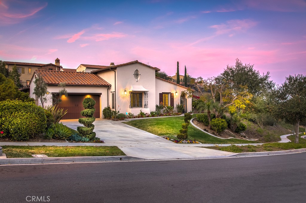 501 Luminous Irvine, CA 92603 - Photo 2 of 53 a front view of a house with a yard and potted plants