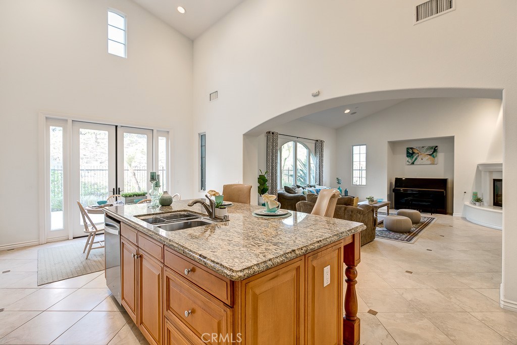 501 Luminous Irvine, CA 92603 - Photo 25 of 53 a dining hall with stainless steel appliances granite countertop a stove and a sink