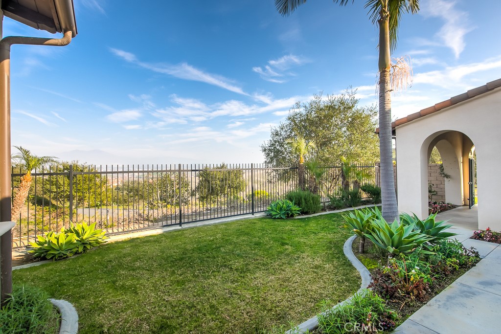501 Luminous Irvine, CA 92603 - Photo 30 of 53 a view of a garden with a building in the background
