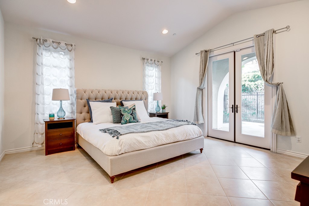 501 Luminous Irvine, CA 92603 - Photo 31 of 53 a spacious bedroom with a bed and large window