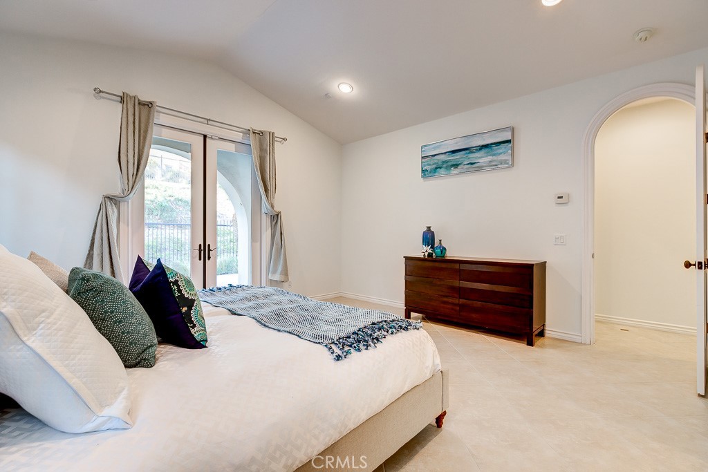 501 Luminous Irvine, CA 92603 - Photo 32 of 53 a bedroom with a bed and a window