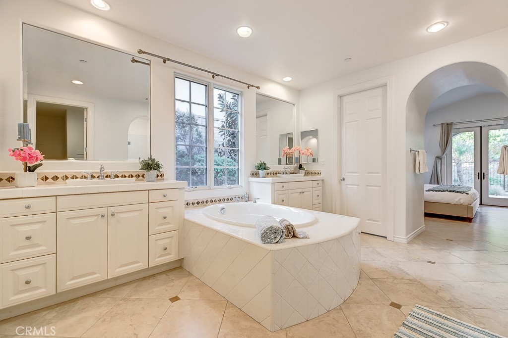 501 Luminous Irvine, CA 92603 - Photo 34 of 53 a large white kitchen with a sink large window and cabinets