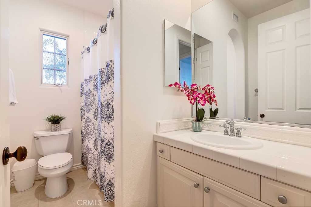 501 Luminous Irvine, CA 92603 - Photo 39 of 53 a bathroom with a sink toilet and shower