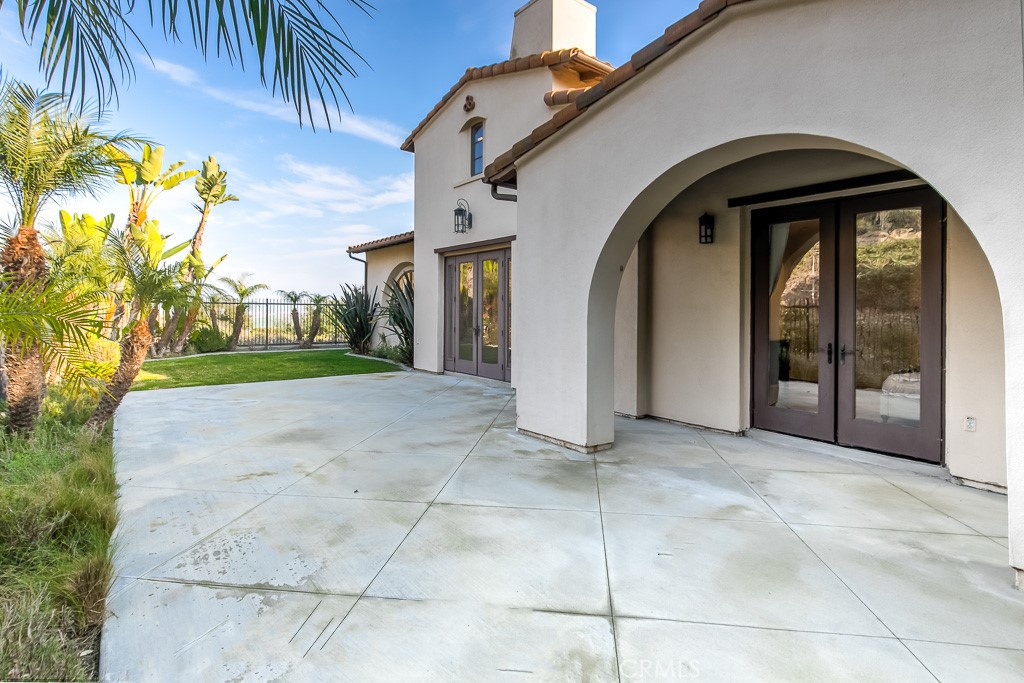 501 Luminous Irvine, CA 92603 - Photo 43 of 53 a view of a grey house with a yard