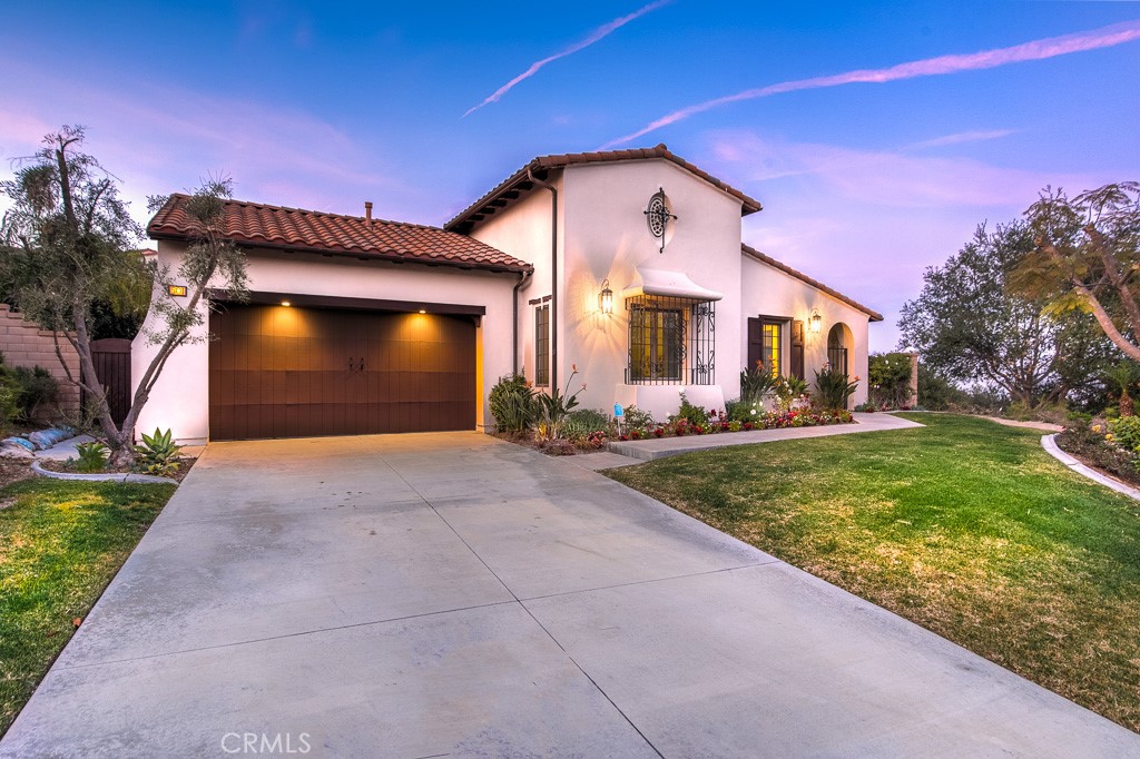 501 Luminous Irvine, CA 92603 - Photo 51 of 53 a front view of a house with a yard and garage