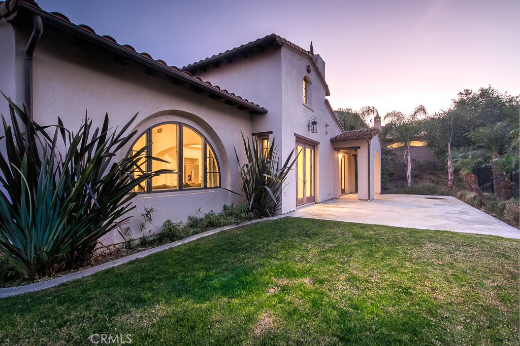 501 Luminous Irvine, CA 92603 - Photo 8 of 53 a front view of a house with yard and green space