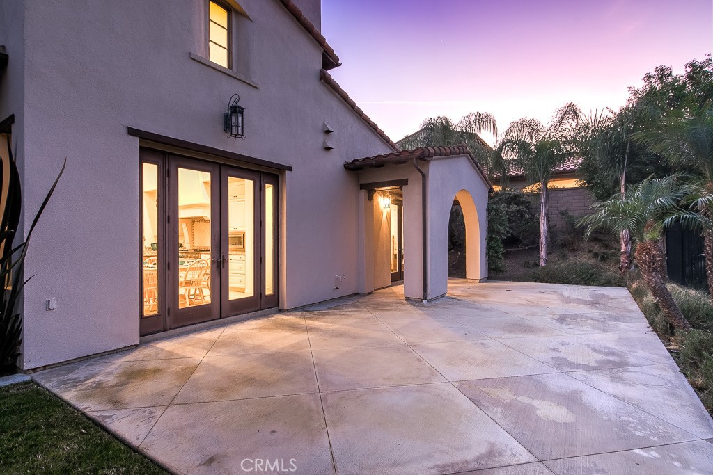 501 Luminous Irvine, CA 92603 - Photo 10 of 53 a view of a house with large windows and a small yard