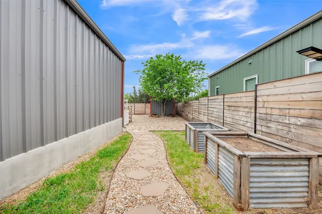 a view of a backyard with sitting area