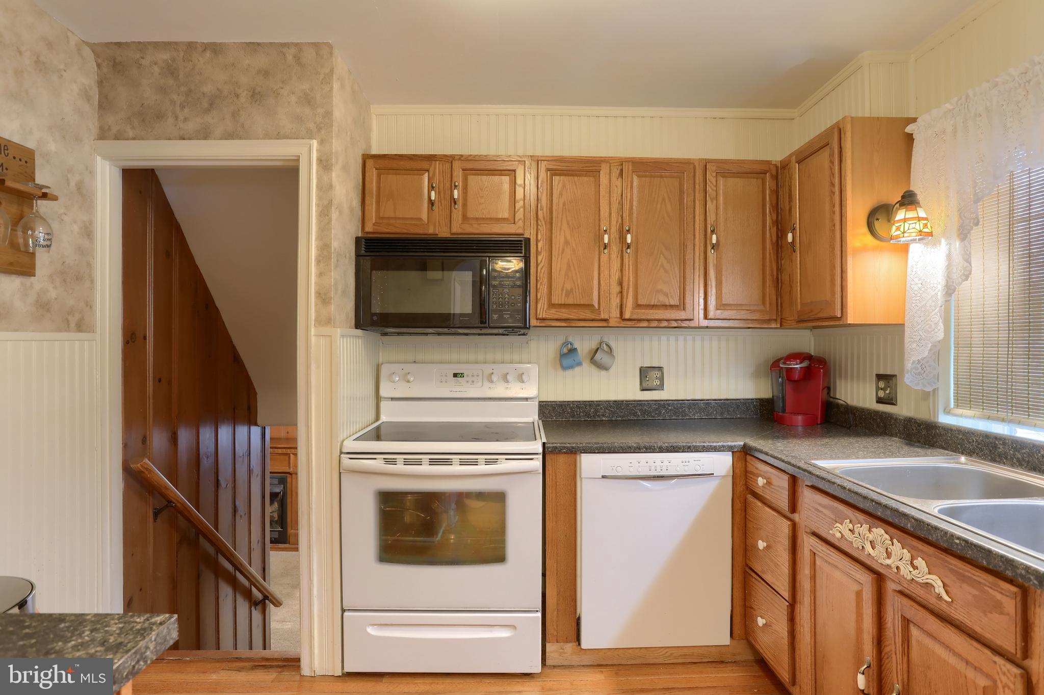 323 South 3rd Avenue Lebanon, PA 17042 - Photo 12 of 33 a kitchen with a stove microwave and sink