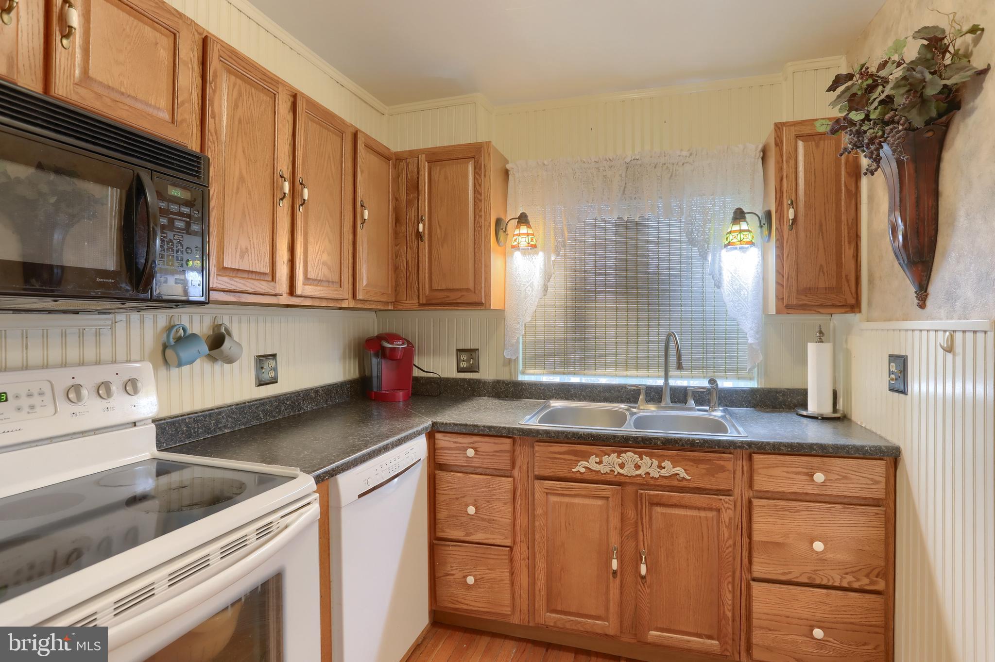 323 South 3rd Avenue Lebanon, PA 17042 - Photo 13 of 33 a kitchen with granite countertop a sink stainless steel appliances and cabinets