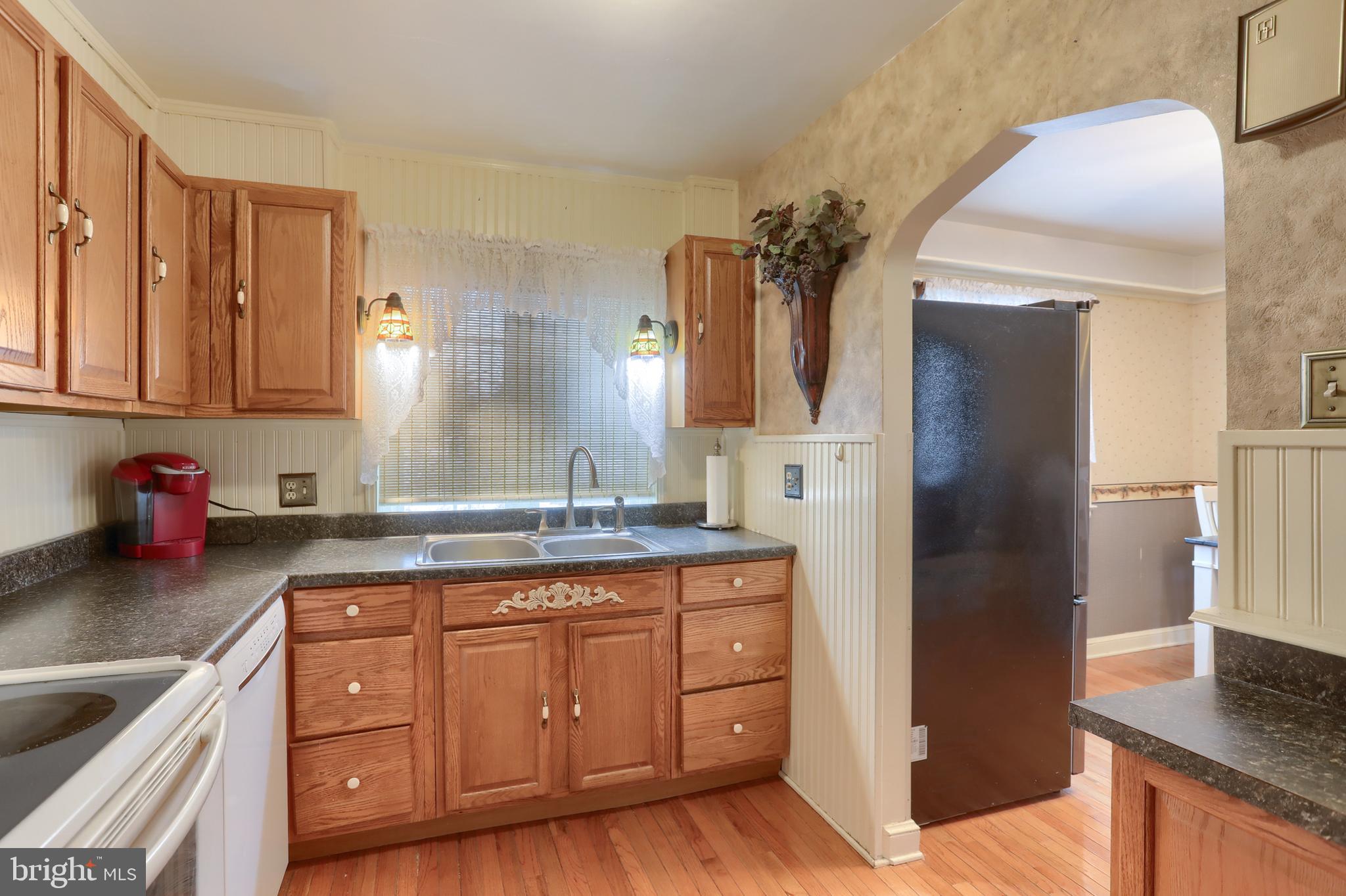 323 South 3rd Avenue Lebanon, PA 17042 - Photo 15 of 33 a kitchen with a sink a refrigerator and cabinets