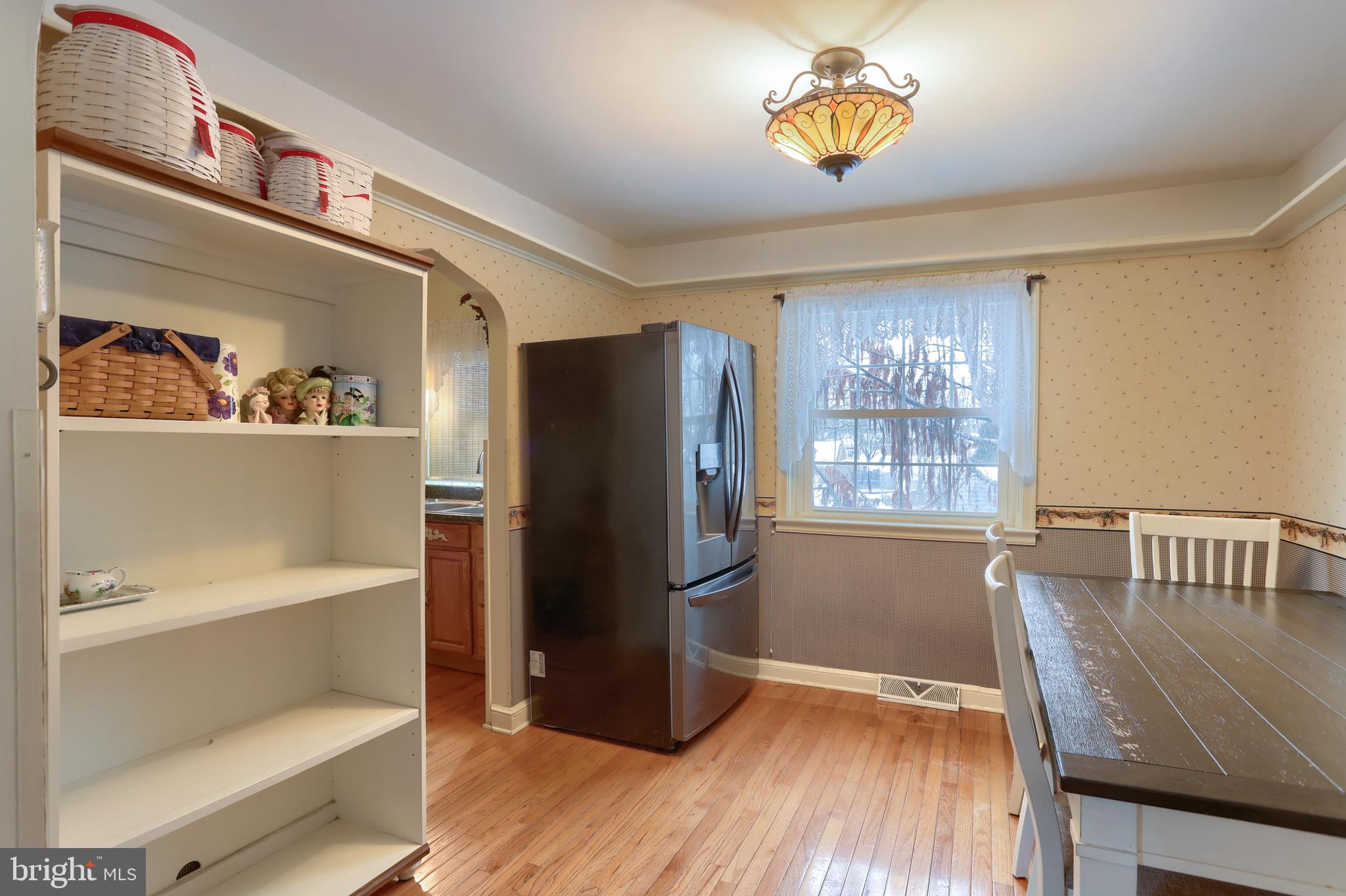 323 South 3rd Avenue Lebanon, PA 17042 - Photo 17 of 33 a kitchen with a refrigerator and a wooden floor